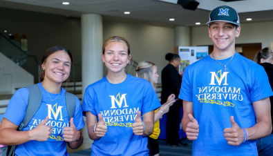 Group of Madonna students smiling and giving thumbs up